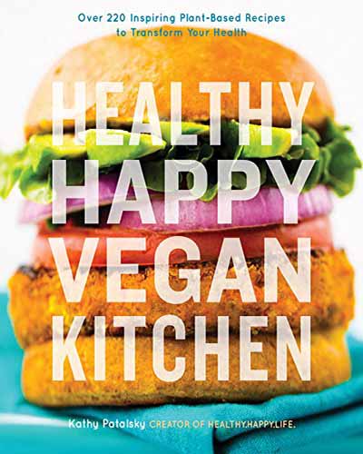 A cover for the book Healthy Happy Vegan Kitchen. Features a large vegan chicken style sandwich.