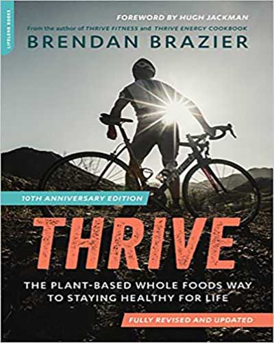 The cover for the book Thrive: The Vegan Nutrition Guide. Features a picture of the author, a man, riding a bicycle.