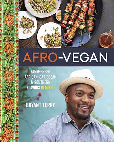 Cover for the book Afro Vegan. Features a picture of the author, a man, on the bottom half and a few dishes of colorful food on the top half.