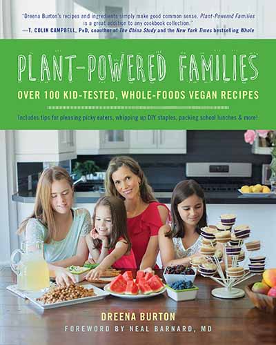 The cover for the book Plant Powered Families. Features a picture of the author and her children sitting at a kitchen table.