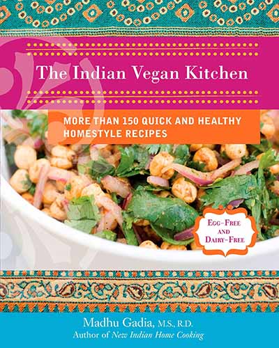 Cover for the book The Indian Vegan Kitchen. Features an up close picture of a bowl of chickpeas and greens.