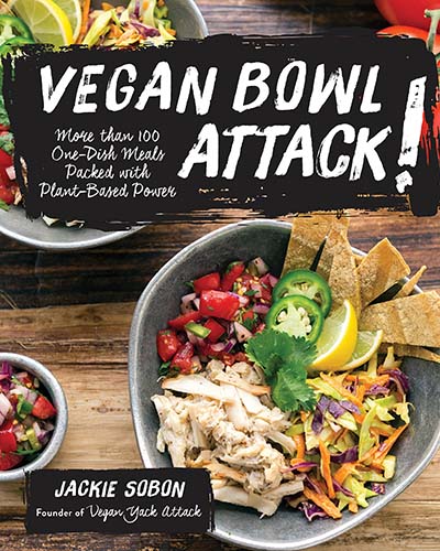 Cover for the cookbook, Vegan Bowl Attack. Cover features two bowls of colorful food sitting on a table. Written in a black box over top the image of the bowls is "Vegan Bowl Attack" written in white lettering.