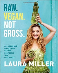 Cover for the book, Raw Vegan Not Gross. Features a picture of the author holding vegetables while standing in front of a teal door.