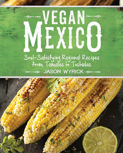 Cover for the book, Vegan Mexico. Features an picture of grilled corn with lime wedges.