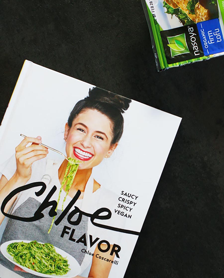 An overhead photo of the cookbook, Chloe Flavor, and a package of Nasoya tofu.