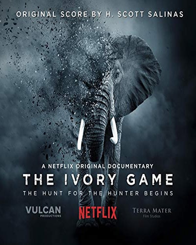 Cover for the film, The Ivory Game. Features a dark background with a large picture of a disappearing elephant.