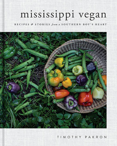 Cover for the book, Mississippi Vegan, that features a bowl of fresh food also surrounded by colorful fresh foods.