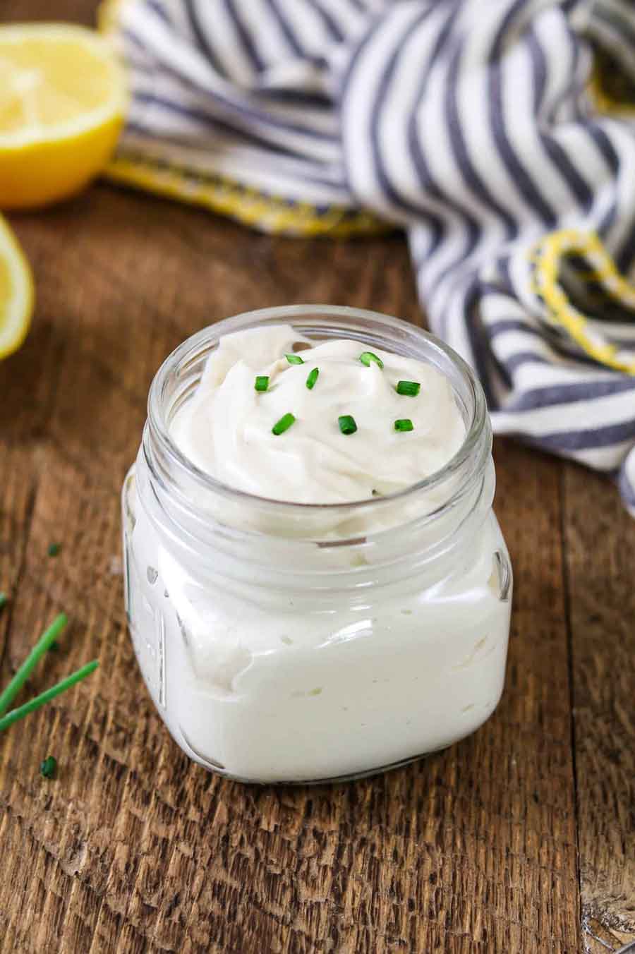 Jar of sour cream on table